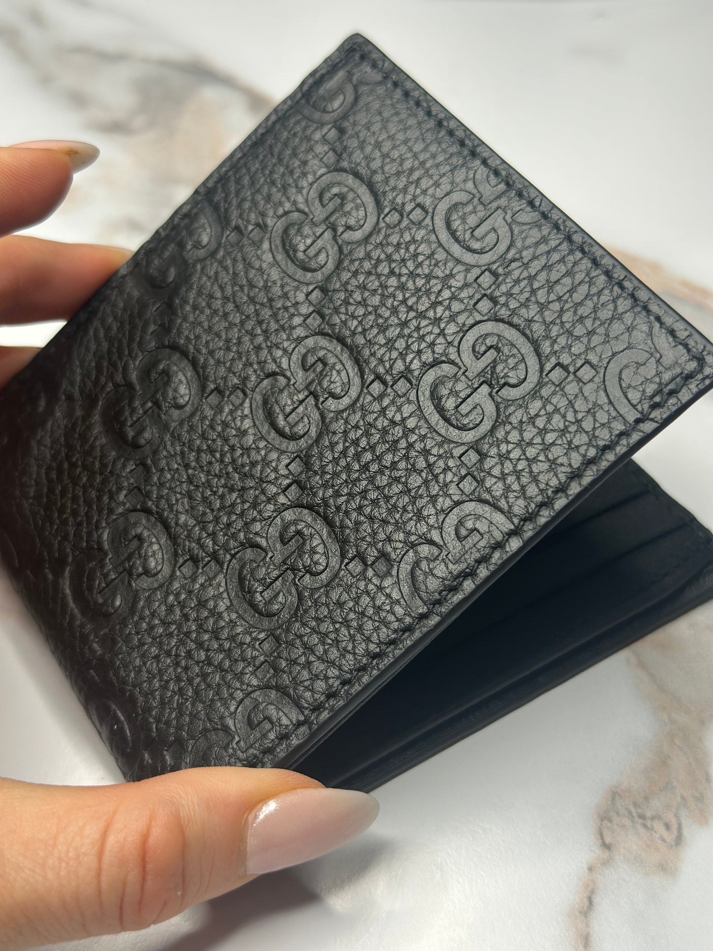 Pre-owned Gucci GG Embossed leather mens bi-fold wallet