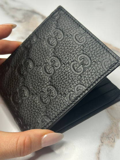 Pre-owned Gucci GG Embossed leather mens bi-fold wallet