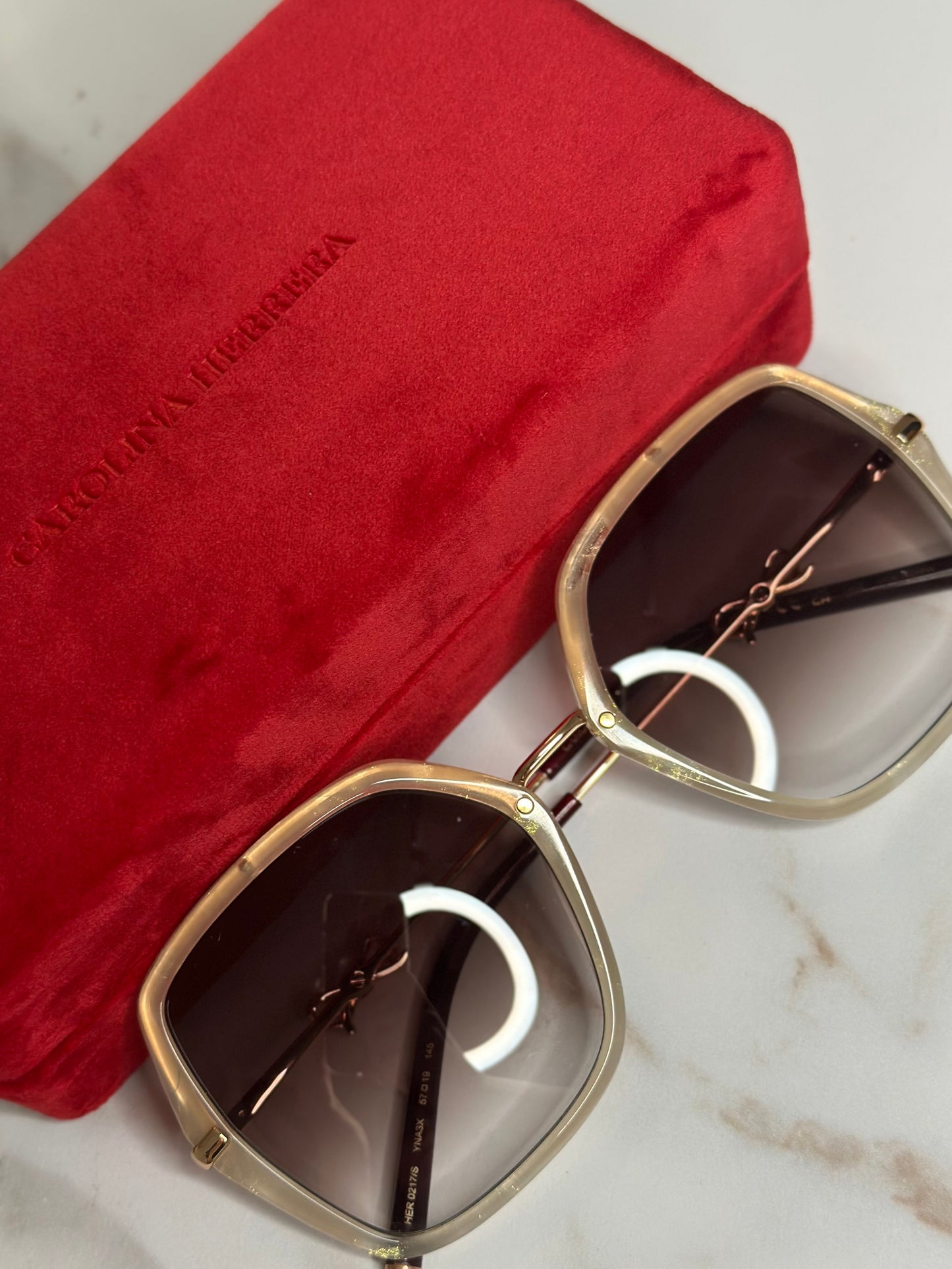 Pre-owned Carolina Herrera white sunglasses with bow detail