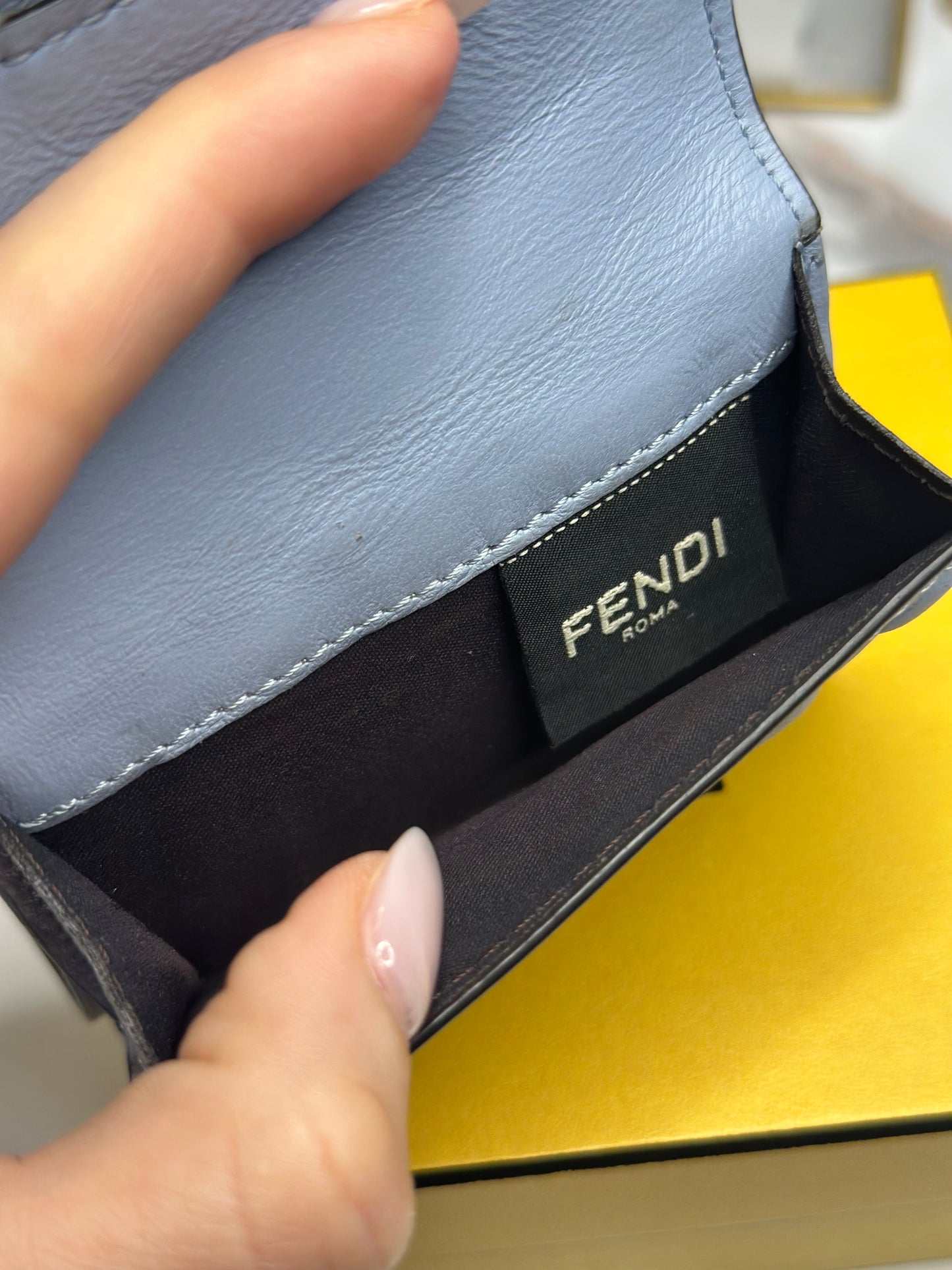 Pre-owned Fendi Micro Trifold Baguette wallet is made from light blue lambskin leather