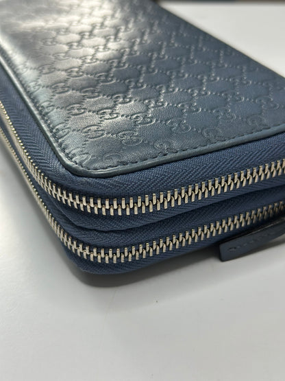 Pre-owned Gucci Microguccissima double zip-around wallet in blue leather
