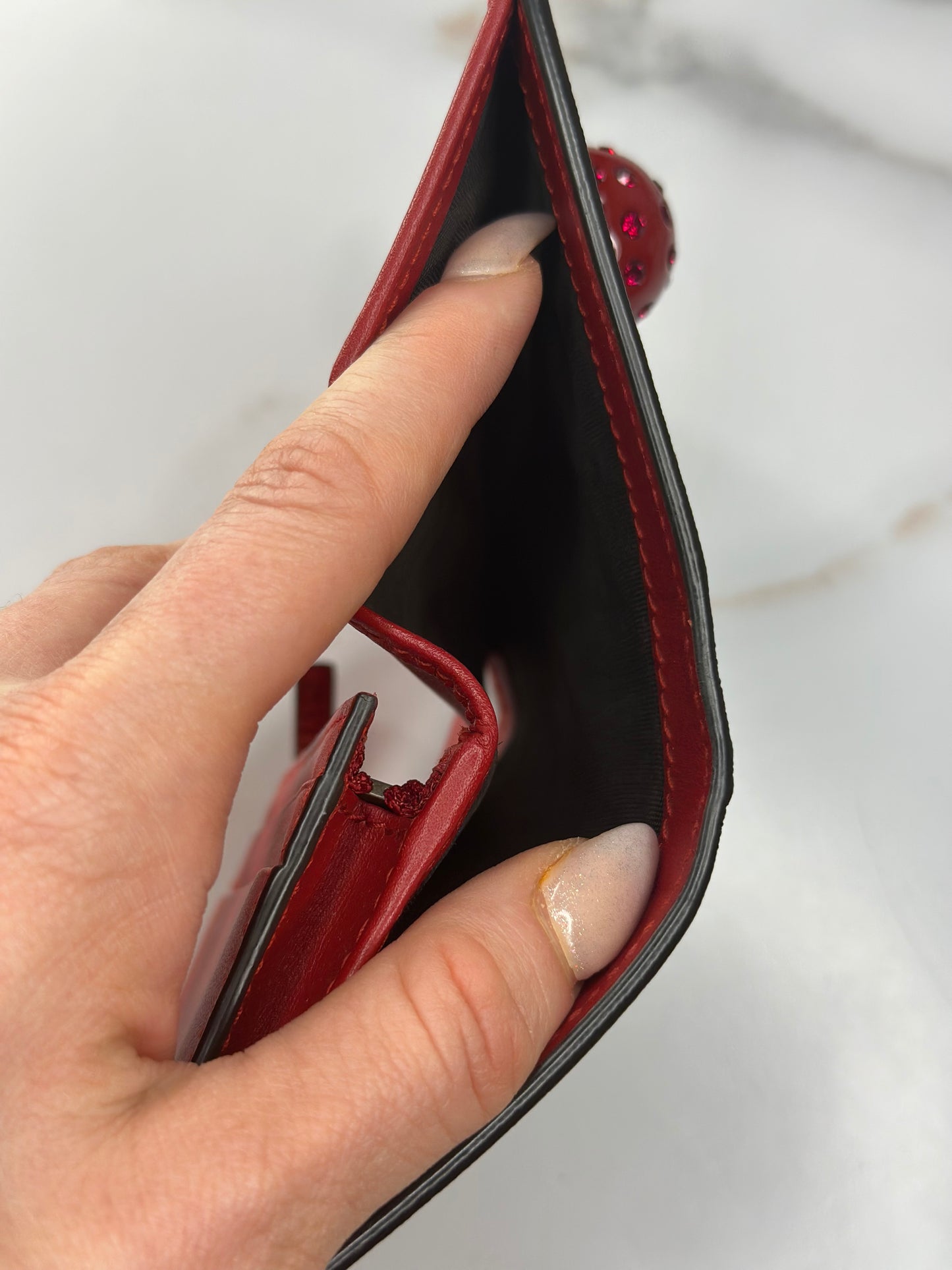 Pre-owned Gucci GG Supreme canvas bifold or compact wallet with a cherry embellishment.