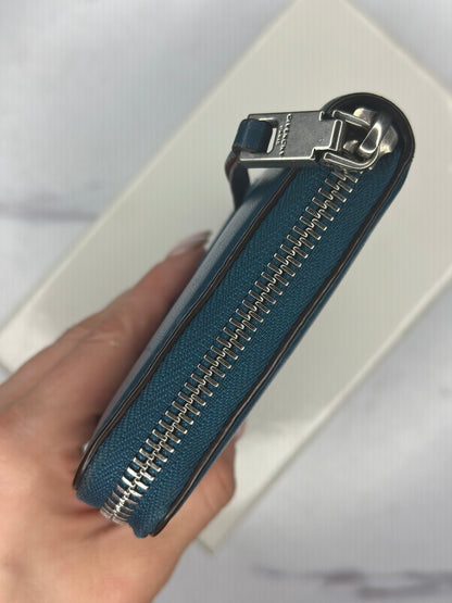 Pre-owned Givenchy dark teal leather zippy wallet