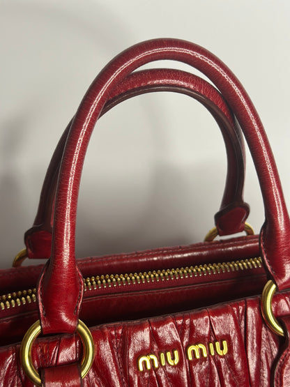 Pre-owned Miu Miu Matelassé 2-way bauletto tote bag in red leather with gold-tone hardware