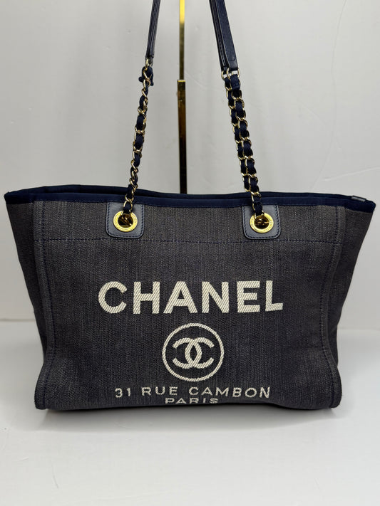 Pre-owned Chanel Deauville tote bag crafted in blue denim with gold-tone hardware medium tote