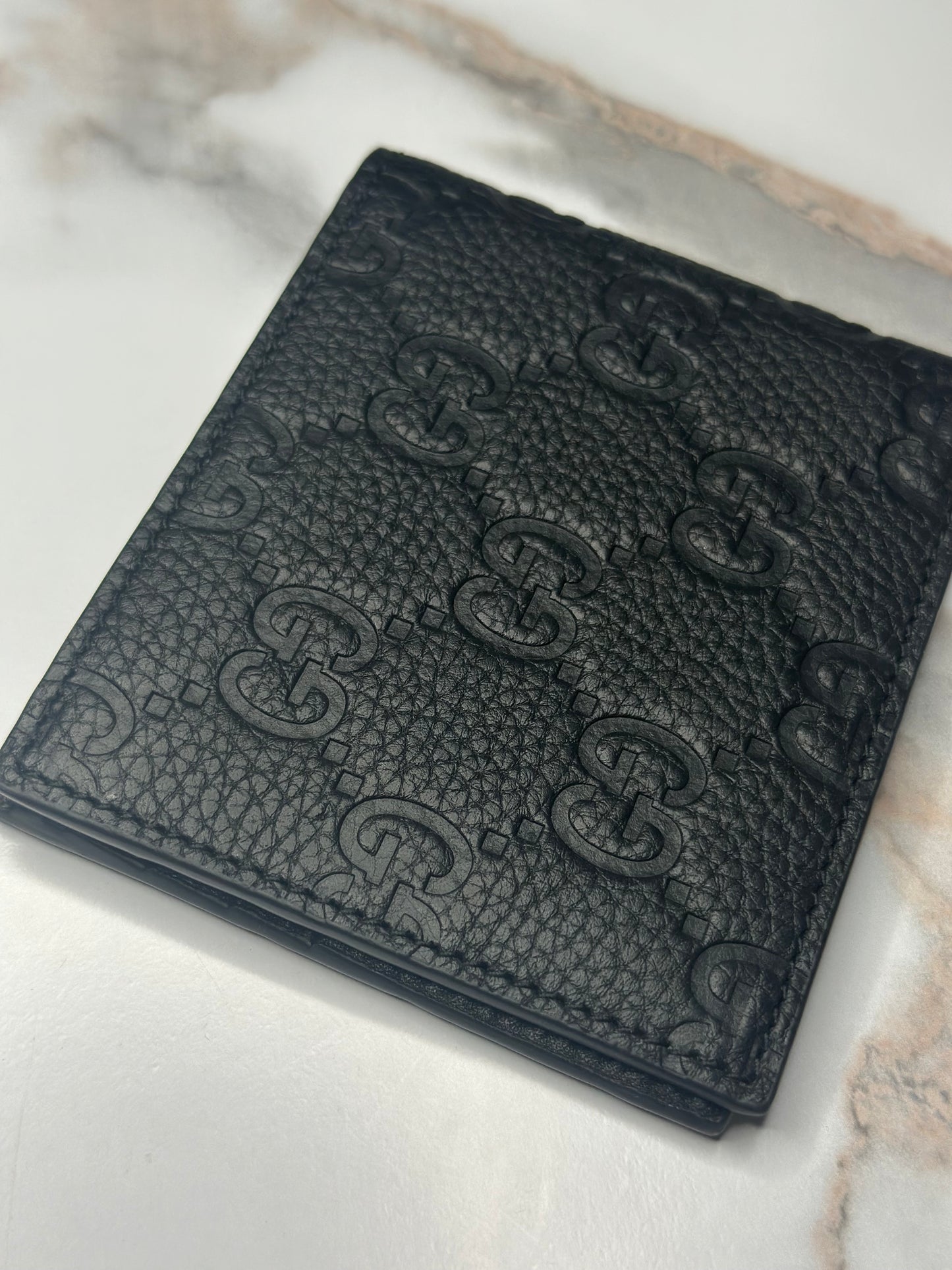 Pre-owned Gucci GG Embossed leather mens bi-fold wallet
