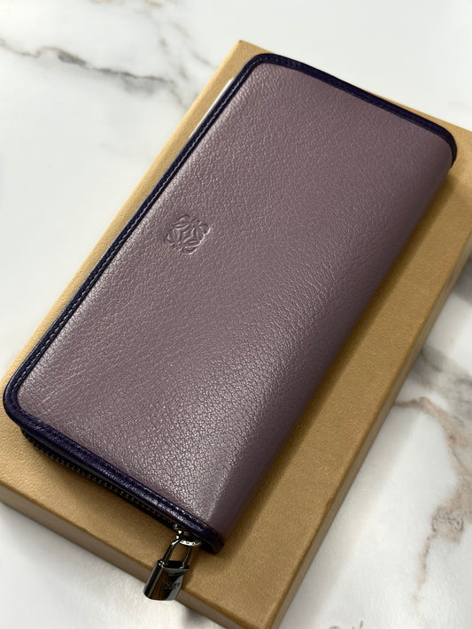 Pre-owned Loewe Anagram continental zip wallet in pebble-grained lilac purple leather