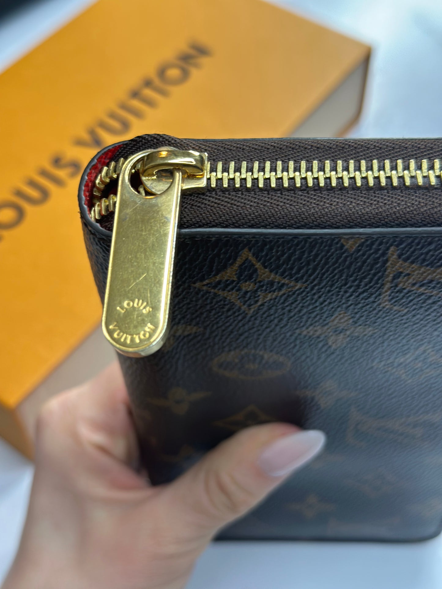 Preowned Louis Vuitton, monogram, canvas, zippy wallet red interior