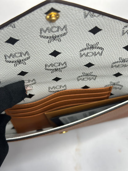 Pre-Owned MCM Himmel Continental Pouch in embossed cognac leather