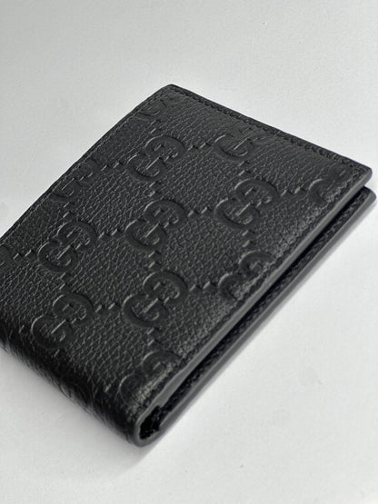 Pre-owned Gucci GG embossed black leather bifold wallet