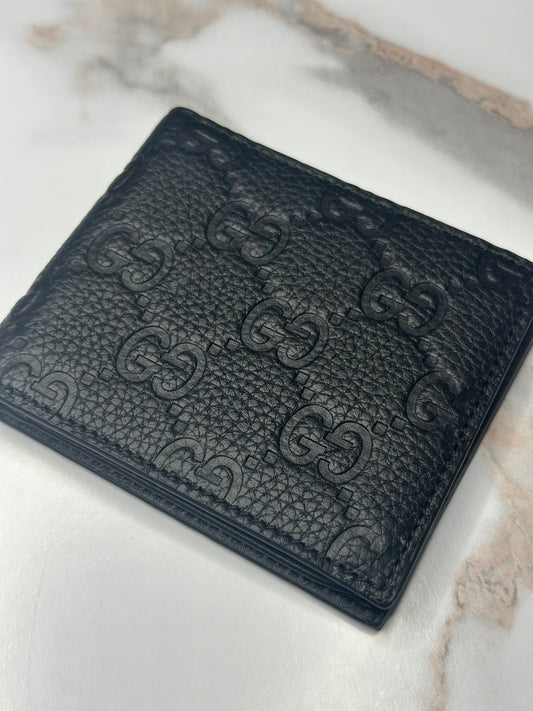 Pre-owned Gucci GG Embossed leather mens bi-fold wallet