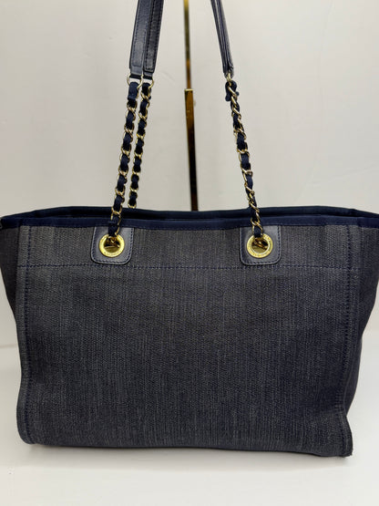 Pre-owned Chanel Deauville tote bag crafted in blue denim with gold-tone hardware medium tote