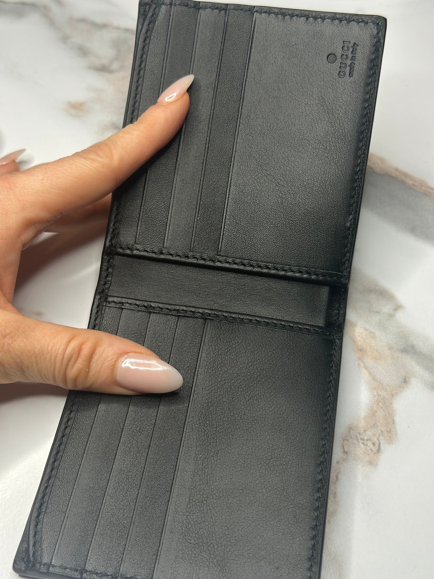 Pre-owned Gucci GG Embossed leather mens bi-fold wallet