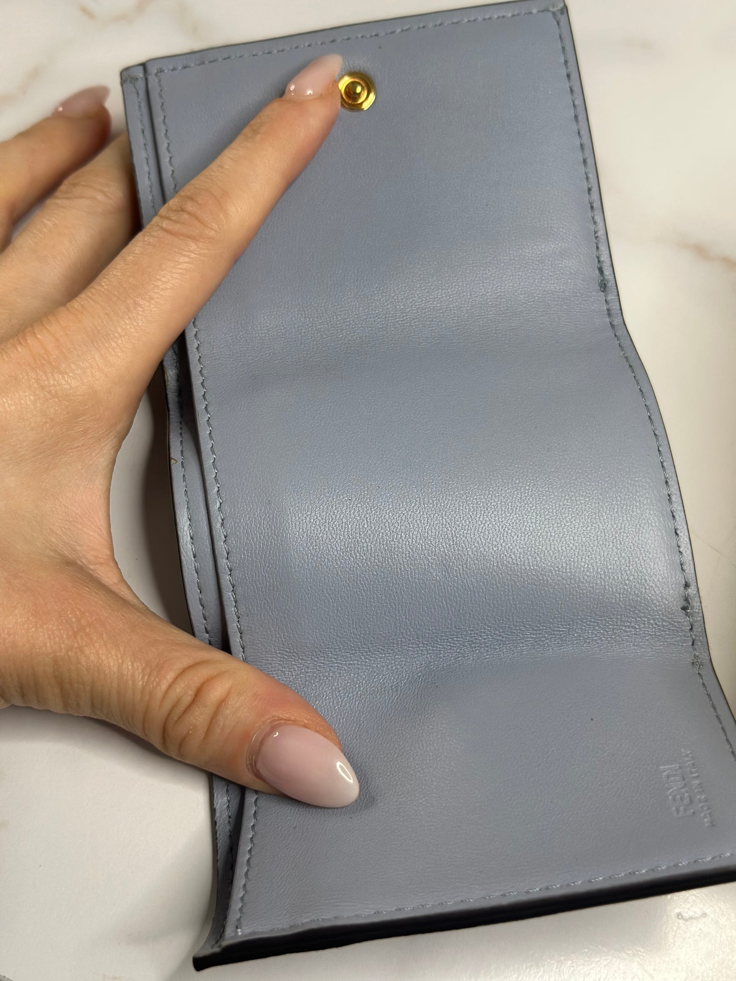 Pre-owned Fendi Micro Trifold Baguette wallet is made from light blue lambskin leather