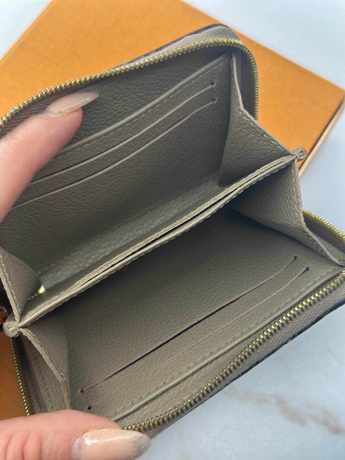 Pre-owned Louis Vuitton monogram Empriente leather compact zippy