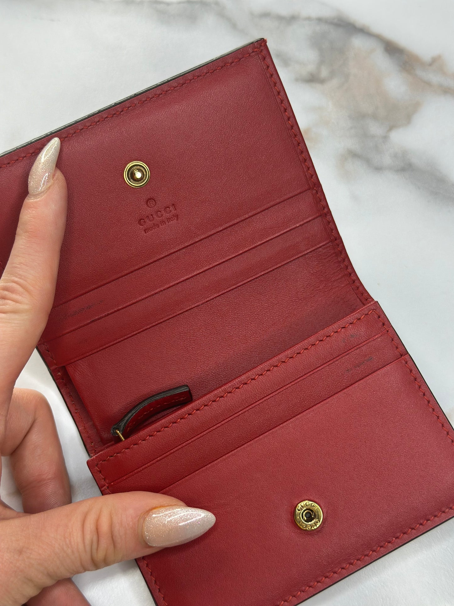 Pre-owned Gucci GG Supreme canvas bifold or compact wallet with a cherry embellishment.