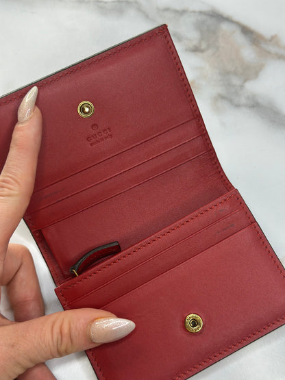 Pre-owned Gucci GG Supreme canvas bifold or compact wallet with a cherry embellishment.