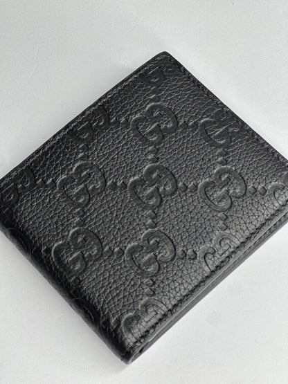 Pre-owned Gucci GG embossed black leather bifold wallet