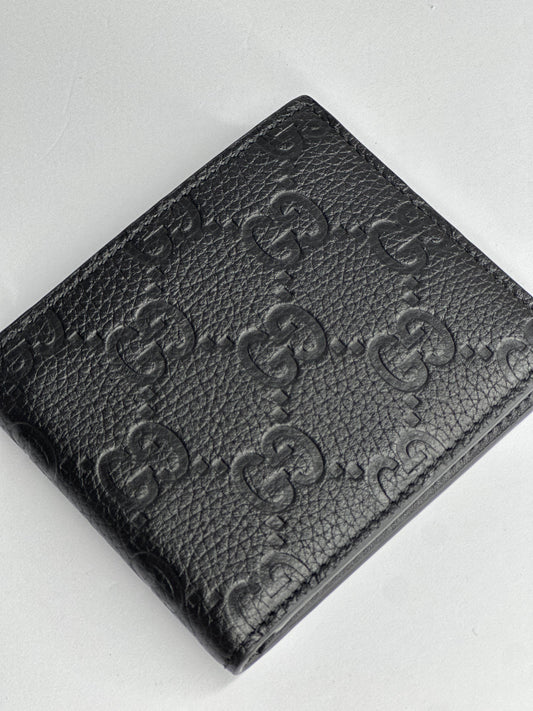 Pre-owned Gucci GG embossed black leather bifold wallet
