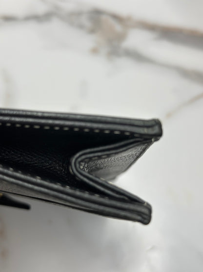 Pre-owned Saint Laurent pebbled leather black leather
